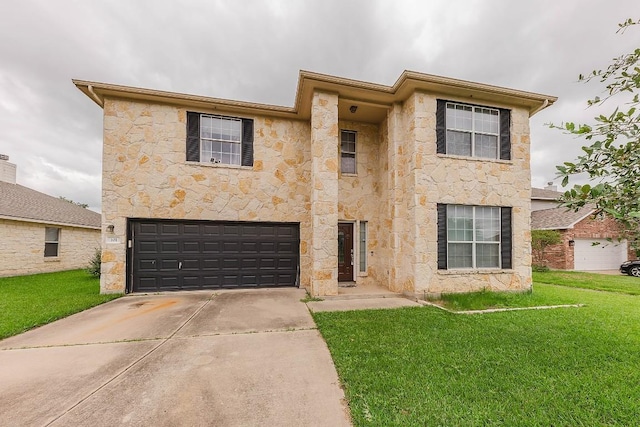 view of front of house with a garage and a front yard