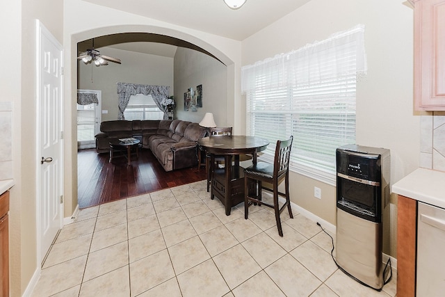 dining room with ceiling fan and light wood-type flooring