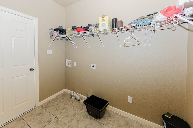 laundry room with hookup for a washing machine, hookup for a gas dryer, tile patterned floors, and electric dryer hookup