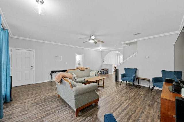 living room with crown molding, ceiling fan, and dark hardwood / wood-style flooring