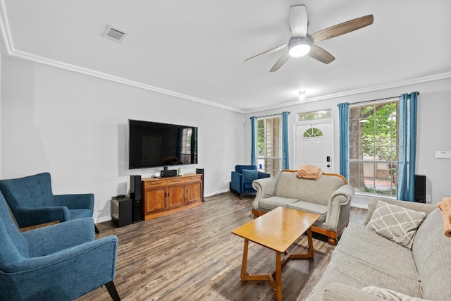 living room featuring ceiling fan, hardwood / wood-style flooring, and ornamental molding