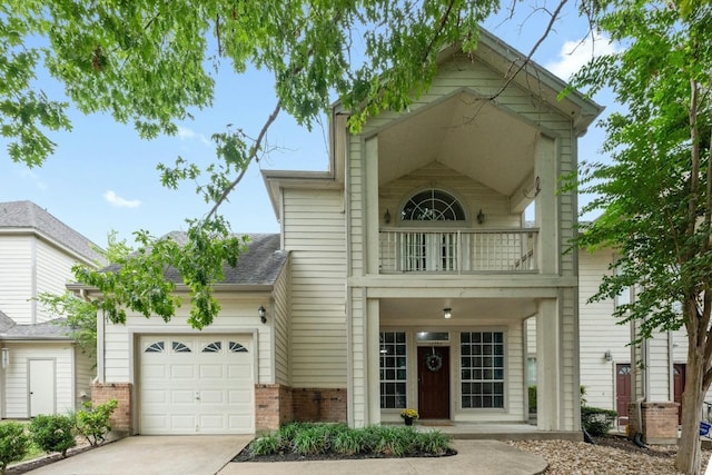 view of front of house featuring a balcony and a garage