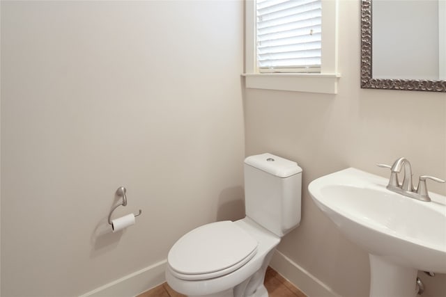 bathroom with toilet and sink