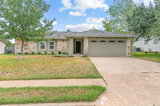 ranch-style home with a front lawn and a garage