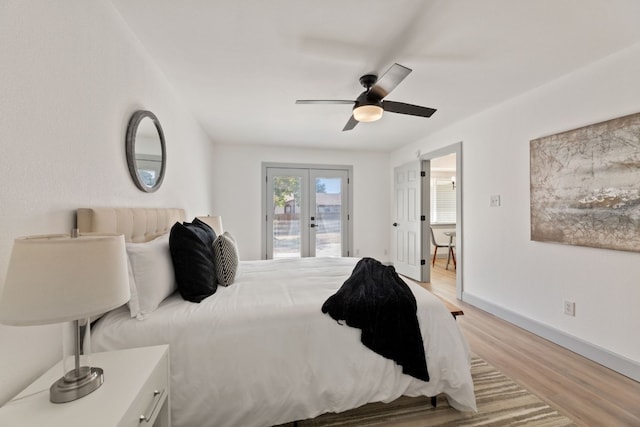 bedroom featuring light hardwood / wood-style flooring, ceiling fan, access to outside, and french doors