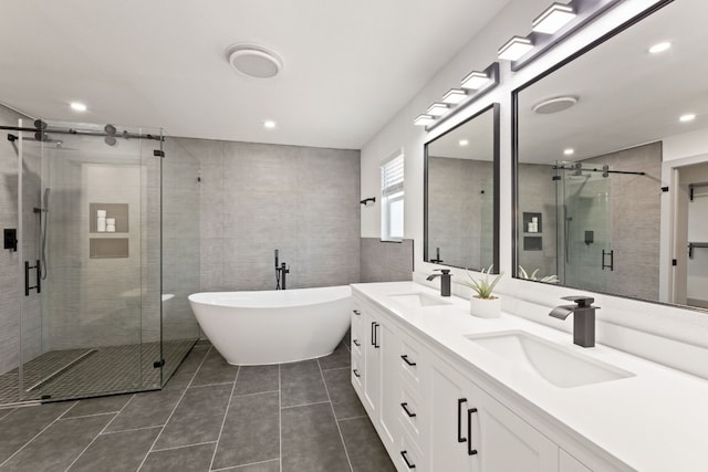 bathroom with vanity, plus walk in shower, and tile patterned flooring