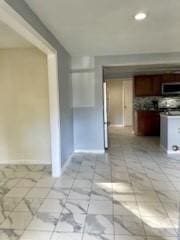 interior space featuring baseboards