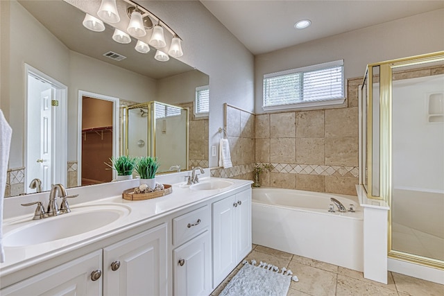 bathroom featuring tile patterned floors, vanity, and independent shower and bath