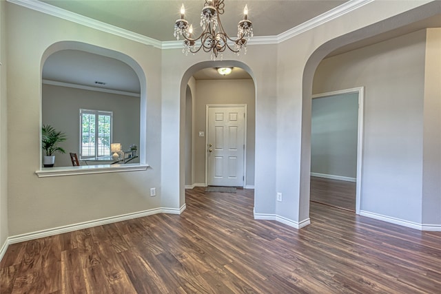 spare room featuring crown molding and dark wood-type flooring