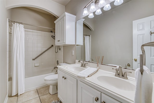 full bathroom with vanity, tile patterned floors, shower / bath combination with curtain, and toilet