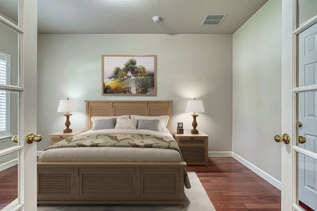 bedroom featuring dark wood-type flooring