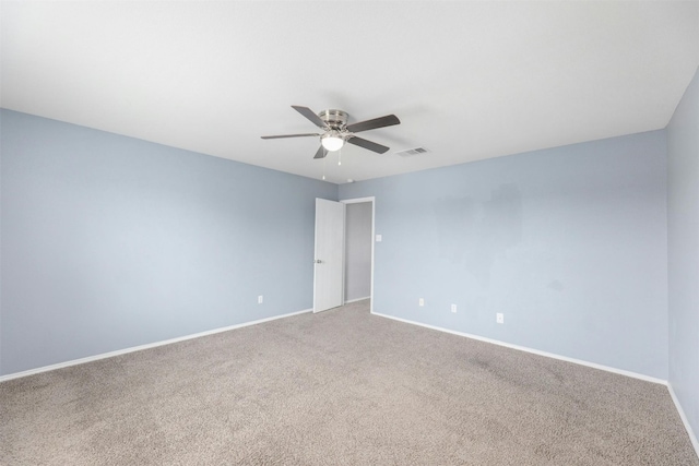 spare room with ceiling fan and carpet floors