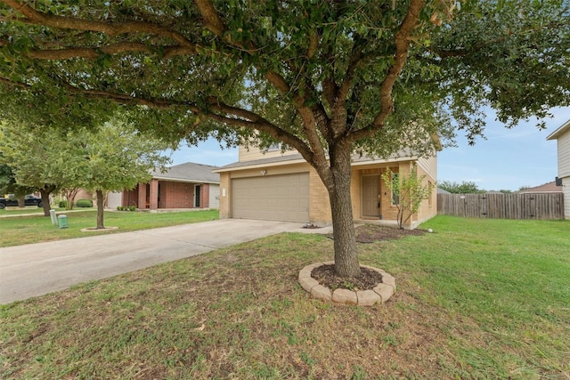 view of front of home with a garage and a front lawn