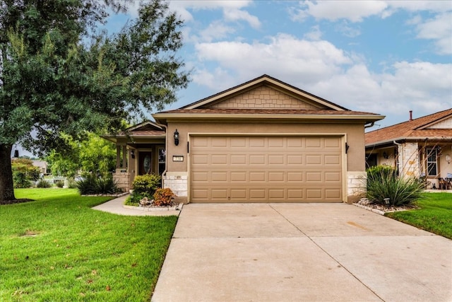 view of front of house with a garage and a front lawn