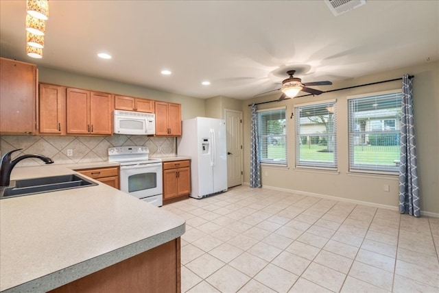 kitchen featuring ceiling fan, sink, light tile patterned floors, and white appliances