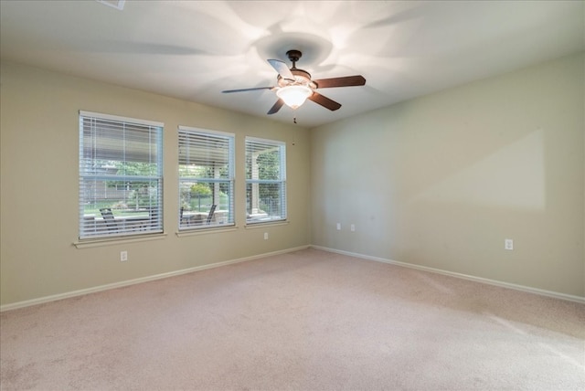 carpeted empty room with ceiling fan