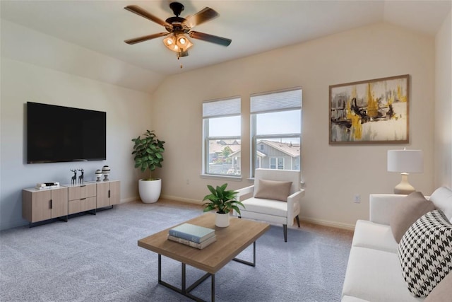 carpeted living room featuring vaulted ceiling and ceiling fan