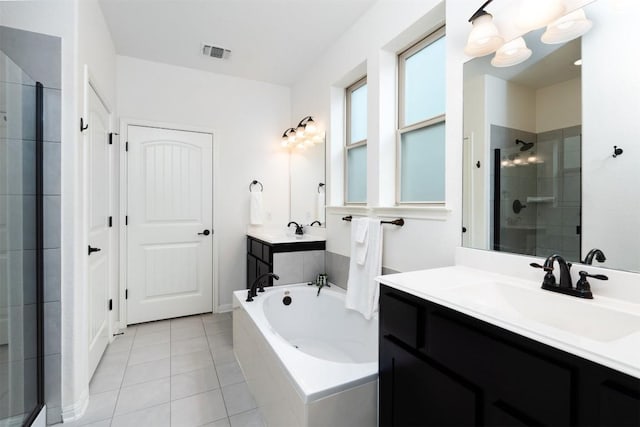 bathroom featuring tile patterned flooring, vanity, and a shower with shower door