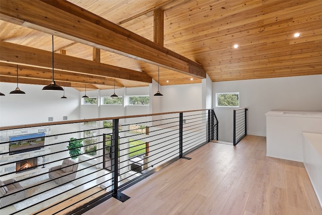 hall featuring wood ceiling, lofted ceiling with beams, and light hardwood / wood-style flooring