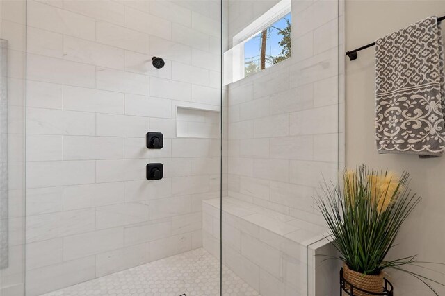 bathroom with tiled shower