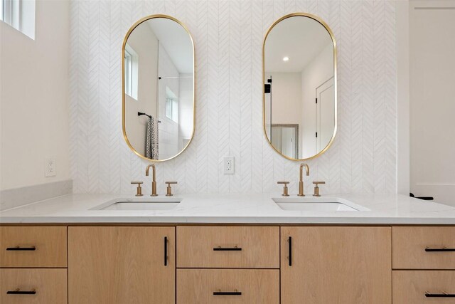 14701 Longbranch Dr, Austin, TX 78734 - full bathroom with wallpapered walls and double vanity