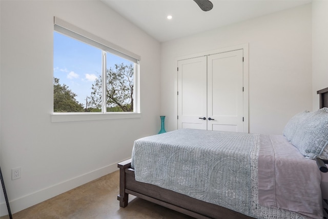 bedroom with a closet, ceiling fan, and carpet