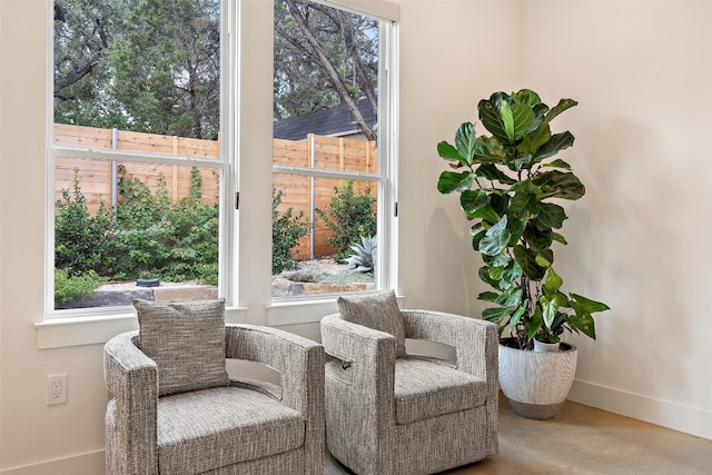 living area with concrete flooring