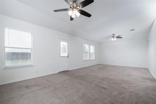 unfurnished living room with a ceiling fan, carpet, baseboards, and visible vents