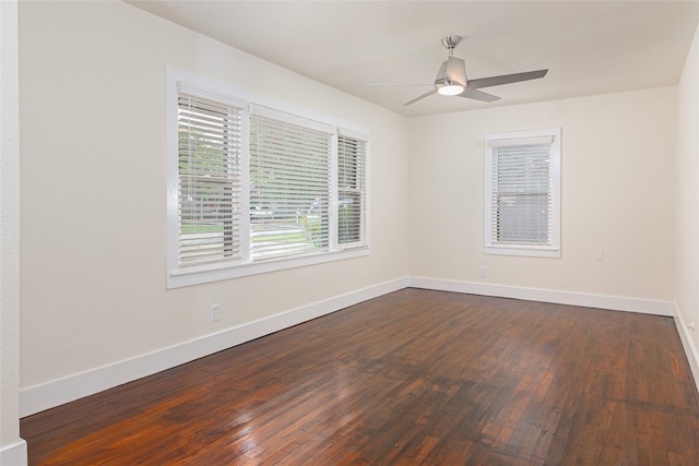 unfurnished room featuring ceiling fan and dark hardwood / wood-style floors