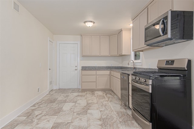 kitchen with appliances with stainless steel finishes and sink