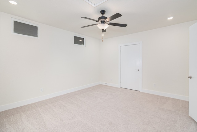 carpeted empty room featuring ceiling fan