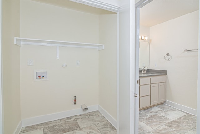 clothes washing area featuring washer hookup, gas dryer hookup, and sink