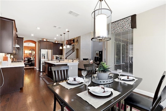 dining room with dark wood-type flooring