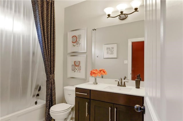 full bathroom featuring shower / bath combo with shower curtain, toilet, and vanity