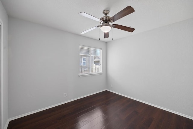 spare room featuring hardwood / wood-style floors and ceiling fan