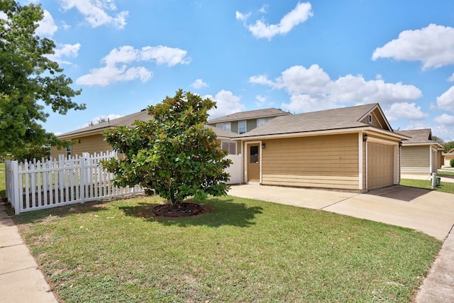 view of front of home with a garage and a front lawn