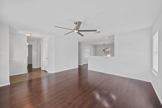 interior space featuring ceiling fan and dark hardwood / wood-style flooring