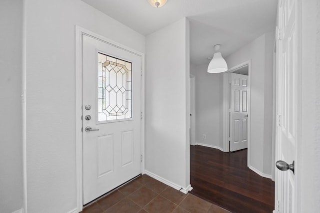 foyer with dark hardwood / wood-style floors