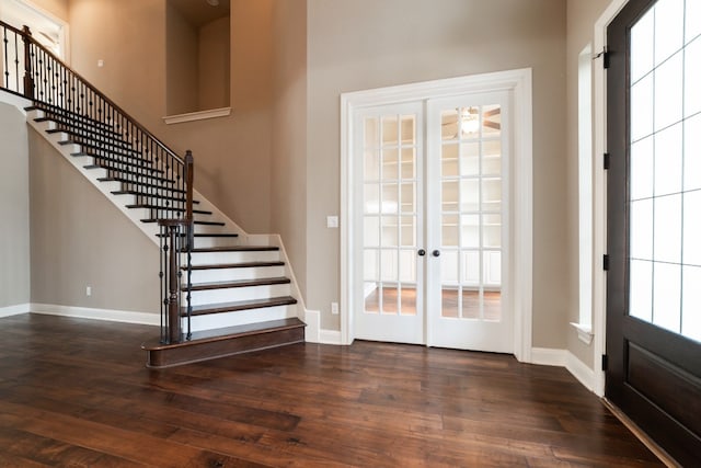 foyer with french doors and dark wood-type flooring