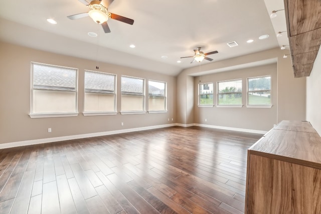 unfurnished room with ceiling fan and dark wood-type flooring