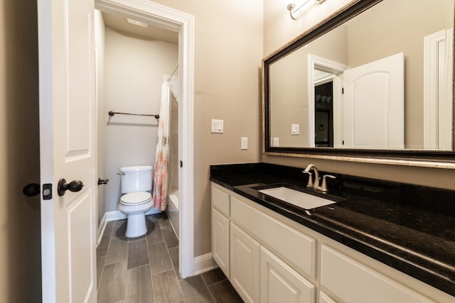 full bathroom with shower / bath combo, vanity, and toilet