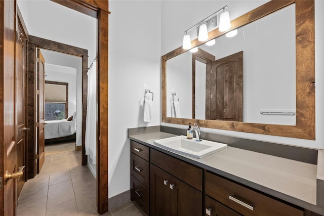 bathroom with vanity and tile patterned flooring