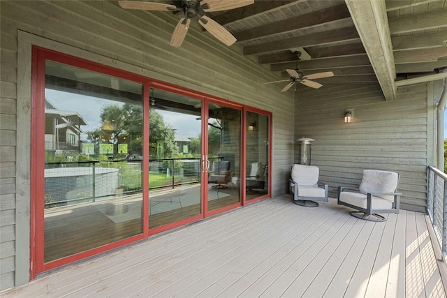 wooden terrace featuring ceiling fan