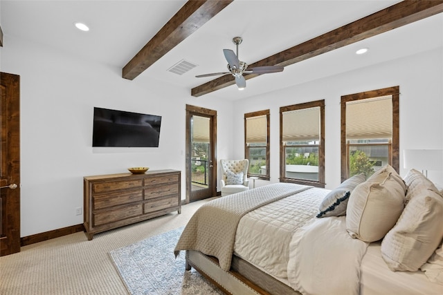 carpeted bedroom featuring ceiling fan, beamed ceiling, multiple windows, and access to outside