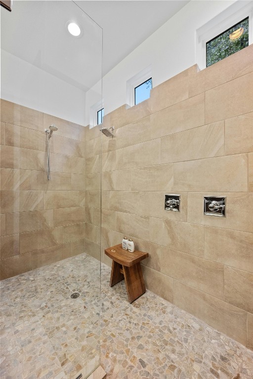 bathroom with a tile shower