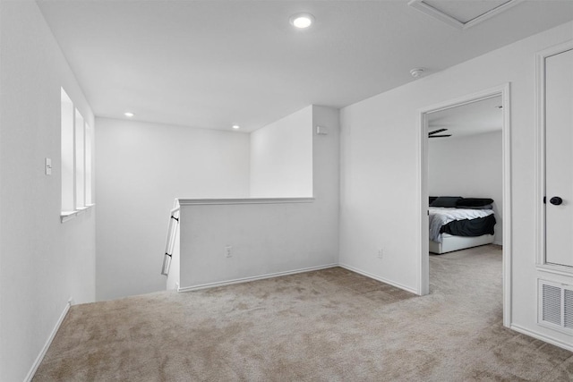 carpeted empty room with recessed lighting and visible vents