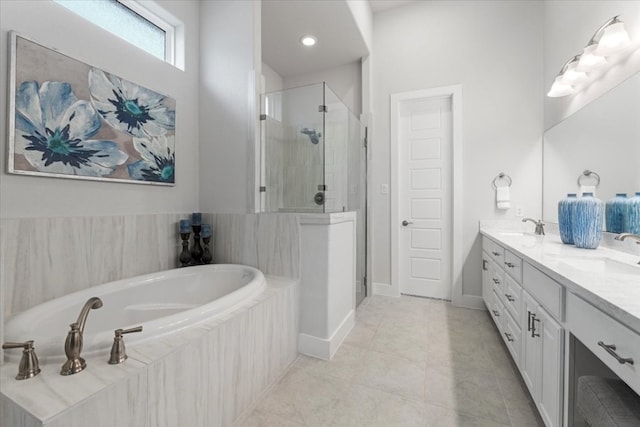 bathroom with tile patterned floors, independent shower and bath, and vanity