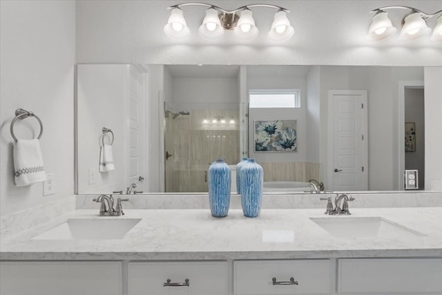 bathroom featuring vanity and separate shower and tub