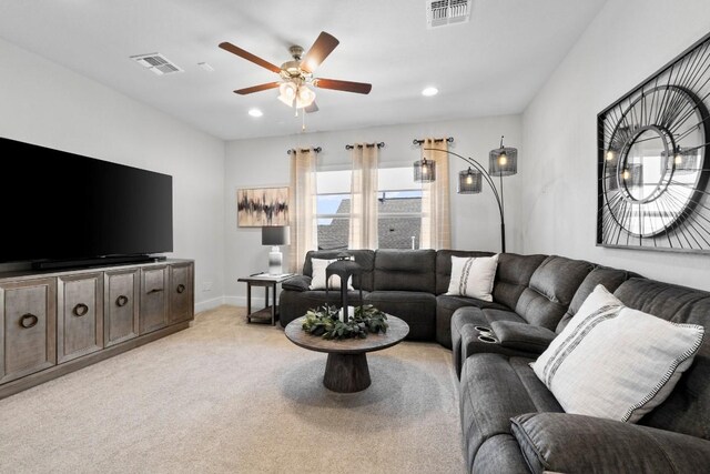 living room featuring light colored carpet and ceiling fan