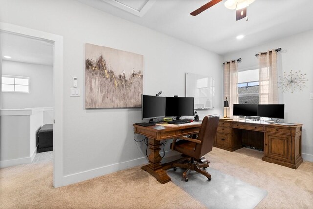 office area featuring ceiling fan and light carpet